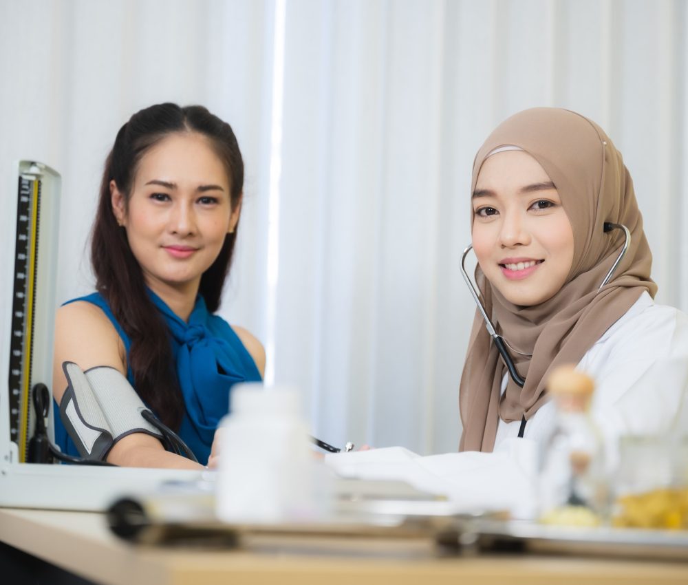muslim doctors explain the health examination results to patient that receives annual health checks.jpg